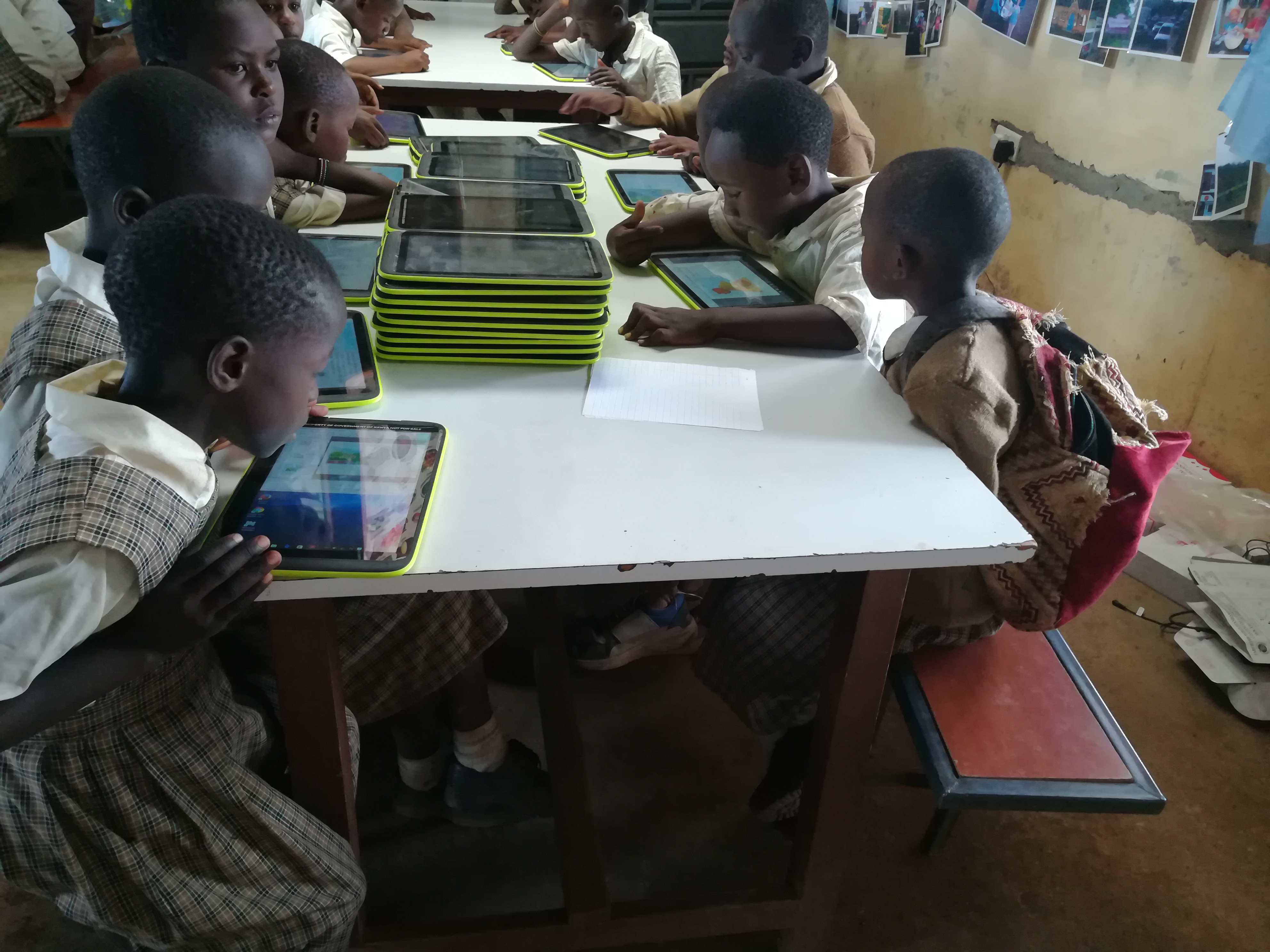 Children reading during a visit to Ndege Primary School 2017